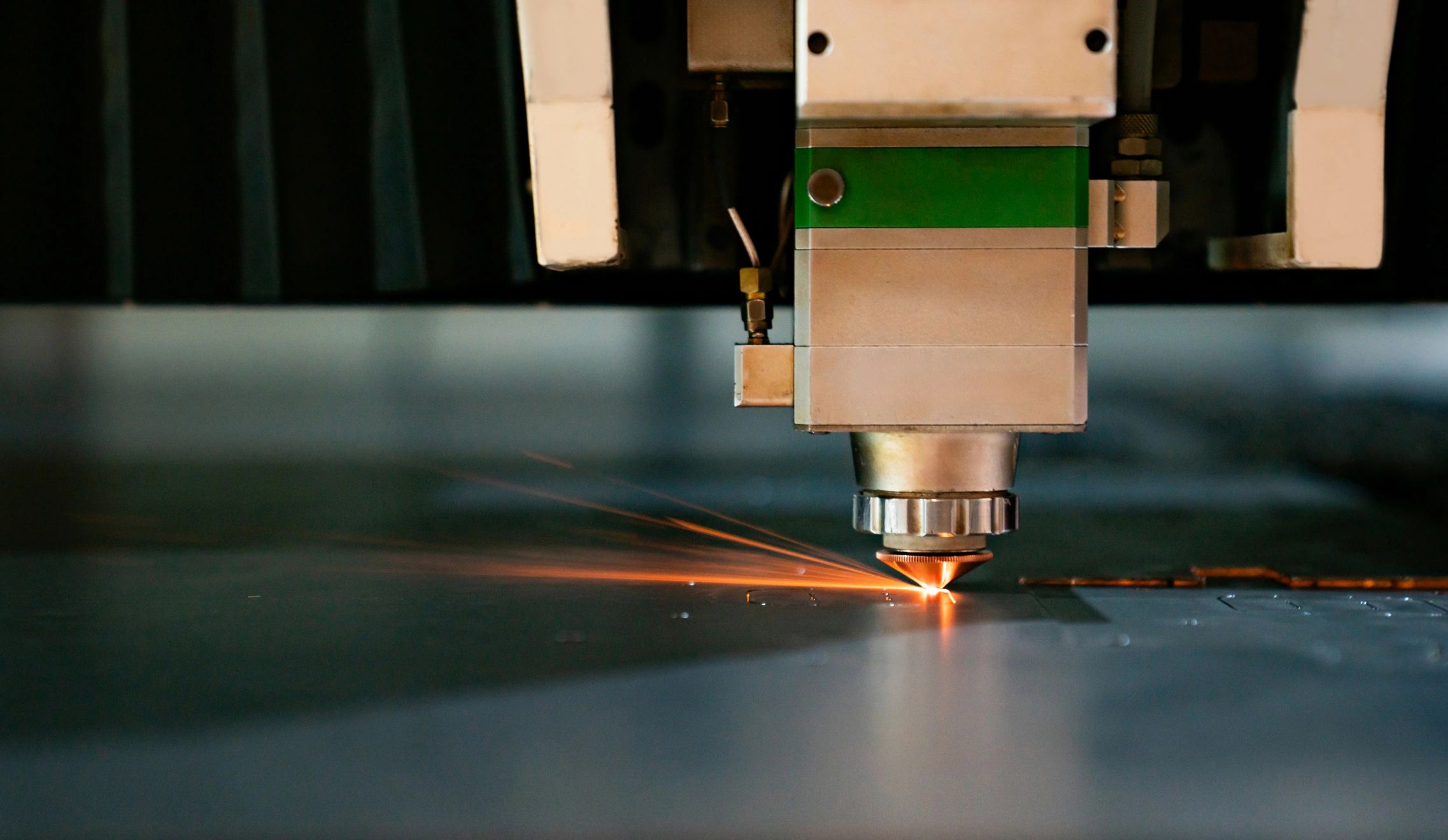 Close-up on a laser machine cutting a metal sheet